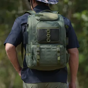 Detail view of olive green tactical fishing backpack worn by an outdoor enthusiast
