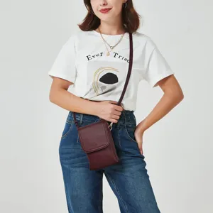 Model wearing a burgundy PU leather cross-body phone bag with a white T-shirt and jeans.