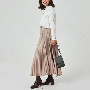 Professional model carrying a chic dark green PU leather phone purse with a slim strap