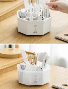 Close-up detail of a white rotating pen holder with stepped compartments