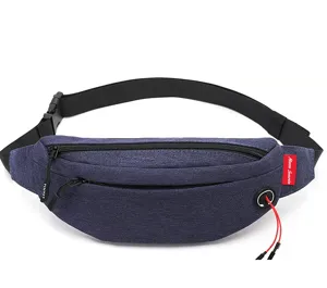 Detailed view of navy blue travel waist bag with earphone port and zipper pockets