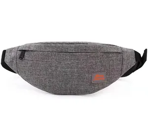 Detail of a lightweight grey travel waist bag with a front zipper and textured fabric.