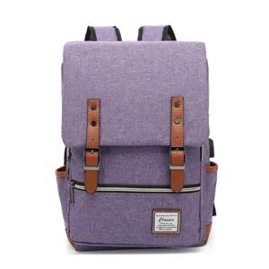 Front view of purple vintage canvas laptop backpack with brown faux leather straps