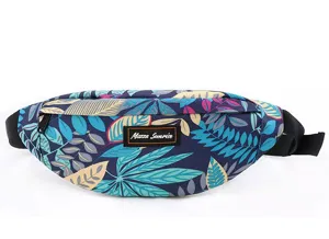 Detailed macro shot of a tropical leaf pattern waist bag featuring Mazza Sunrise logo