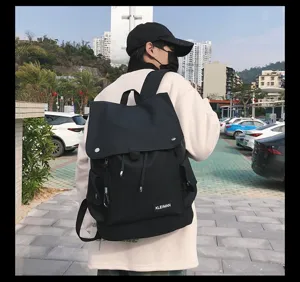 Outdoor lifestyle view of large capacity waterproof black backpack with buckle lid