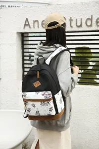 Sac à dos en toile à fleurs décontracté, cartable élégant pour étudiant au design chic.