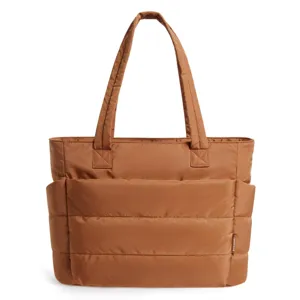 Detailed view of a brown quilted puffer tote bag featuring spacious side compartments