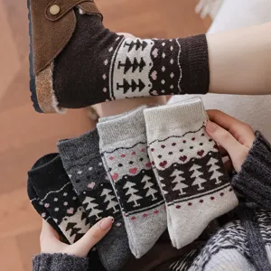 Close-up of vintage Fair Isle wool socks with tree patterns and soft knit texture.