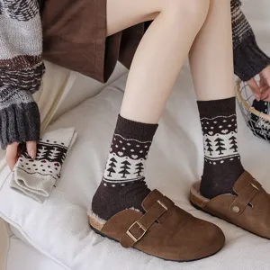 Cozy vintage Fair Isle wool socks with tree patterns worn with brown suede clogs