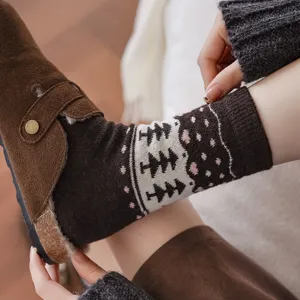 Detail shot of vintage fair isle patterned wool socks with brown suede fleece-lined clogs