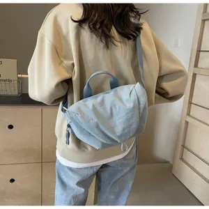 Back view detail of a light blue nylon dumpling crossbody bag for sports and cycling