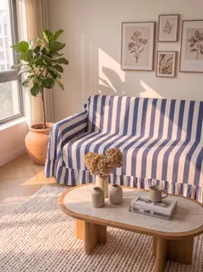 High-quality detail of the blue and white striped velvet sofa cover with ruffled hem.