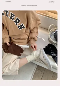 Close-up of beige two-toe socks paired with cream split-toe shoes in a lifestyle setting