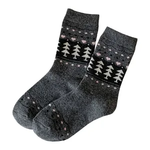 Cozy vintage Fair Isle wool socks featuring classic pine tree patterns for winter warmth