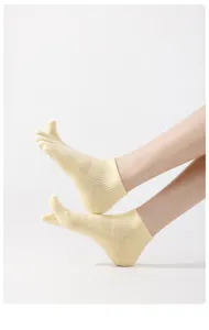 Close-up shot of lightweight cotton five-toe socks with breathable mesh details for summer.