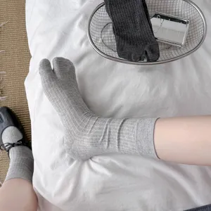 Comfortable solid color split-toe mid-calf socks detail presentation, casual daily wear.