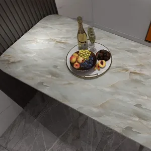 Detail view of marble-patterned waterproof desk sticker applied on a modern dining table
