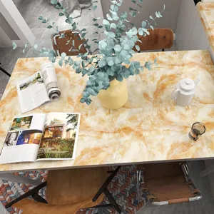 Yellow marble-style waterproof table sticker applied in a cozy dining setting