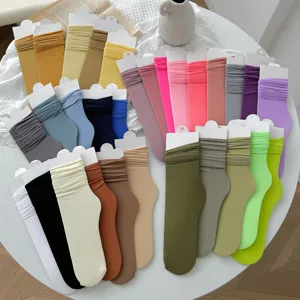 Selection of colorful velvet slouch socks with ribbed texture in various candy colors