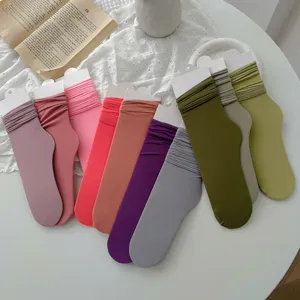 Vibrant candy colored women's velvet slouch mid-calf socks in various trendy summer shades