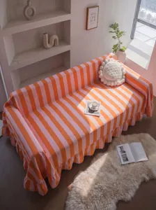 High-weight thick striped velvet sofa cover with ruffled edges in a cozy room setting.
