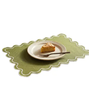 Retro embroidered green placemat with scalloped edges and cotton linen texture