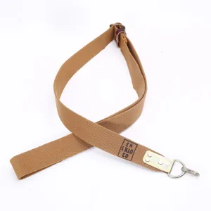 Detail view of durable brown canvas tactical sling featuring a sturdy metal swivel hook