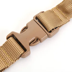Close-up detail of durable brown plastic quick-release buckle on tactical nylon sling strap
