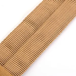 Macro view of tan tactical strap showing durable nylon woven texture details