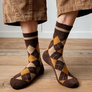 Detailed macro view of men's thick argyle pattern terry socks in brown and yellow