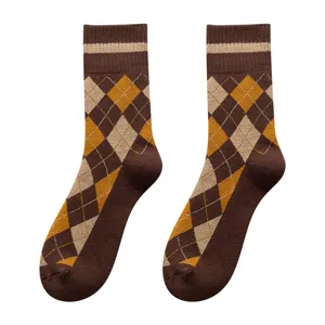 Pair of vintage brown argyle patterned men's crew socks with thick warm terry lining