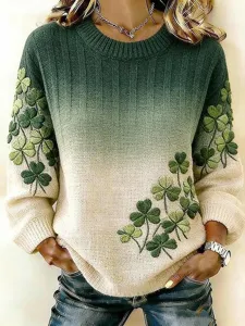 Detailed view of green gradient knit sweater with St. Patrick's Day clover pattern.