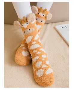 Detailed shot of cute 3D giraffe coral fleece socks with fuzzy texture
