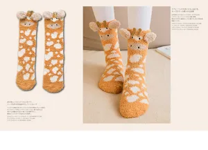 Close-up detail of cute giraffe-patterned coral fleece socks with 3D ears and horns