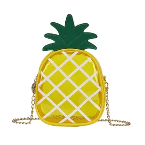 Cute pineapple-shaped transparent yellow crossbody bag featuring a sleek gold chain strap