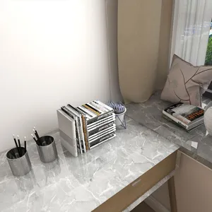 Detailed view of gray marble contact paper applied to a modern home office desk