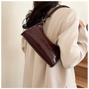 Elegant wine red croc-embossed underarm bag for women with a minimalist leather strap