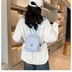 Stylish light blue corduroy mini backpack for women, casual outdoor travel design