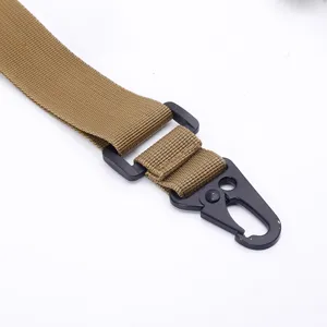 Close-up detail of tactical sling metal hook buckle and durable nylon webbing strap