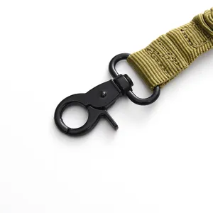 Close-up detail of durable tactical strap metal hook and reinforced nylon webbing for gear.