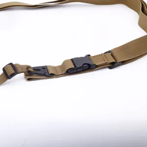 Detail showing the khaki nylon tactical strap with black heavy-duty plastic buckles
