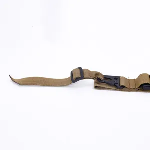 Detailed macro view of khaki tactical 3-point sling strap showing durable hardware clips