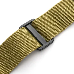 Close-up of tactical nylon strap with black plastic buckle, durable outdoor webbing detail.
