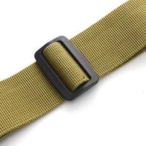 Tactical strap detail showing durable green nylon webbing and black plastic adjustment buckle.