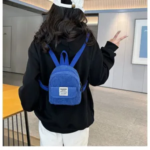 Detailed back view of a stylish blue corduroy mini backpack for women's casual outings