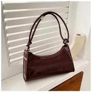 Close-up detail of an elegant dark burgundy stone pattern underarm shoulder bag for women