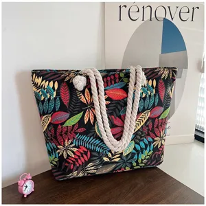 Etnische stijl canvas draagtas met levendige bladprint en decoratieve touwhandvatten