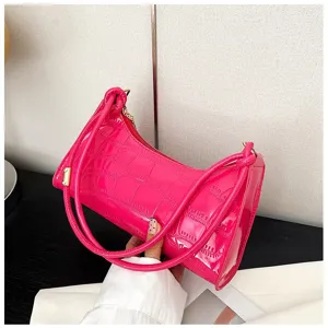 Detailed view of a hot pink glossy stone pattern shoulder bag with a stylish strap