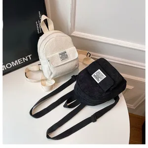 Stylish black and white corduroy mini backpacks for women showing fabric texture