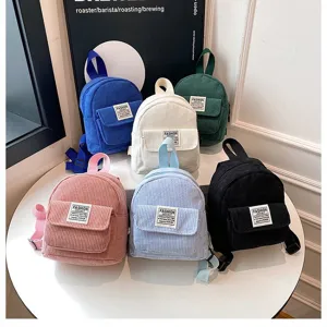 Variety of colorful corduroy mini backpacks for women showing diverse stylish options